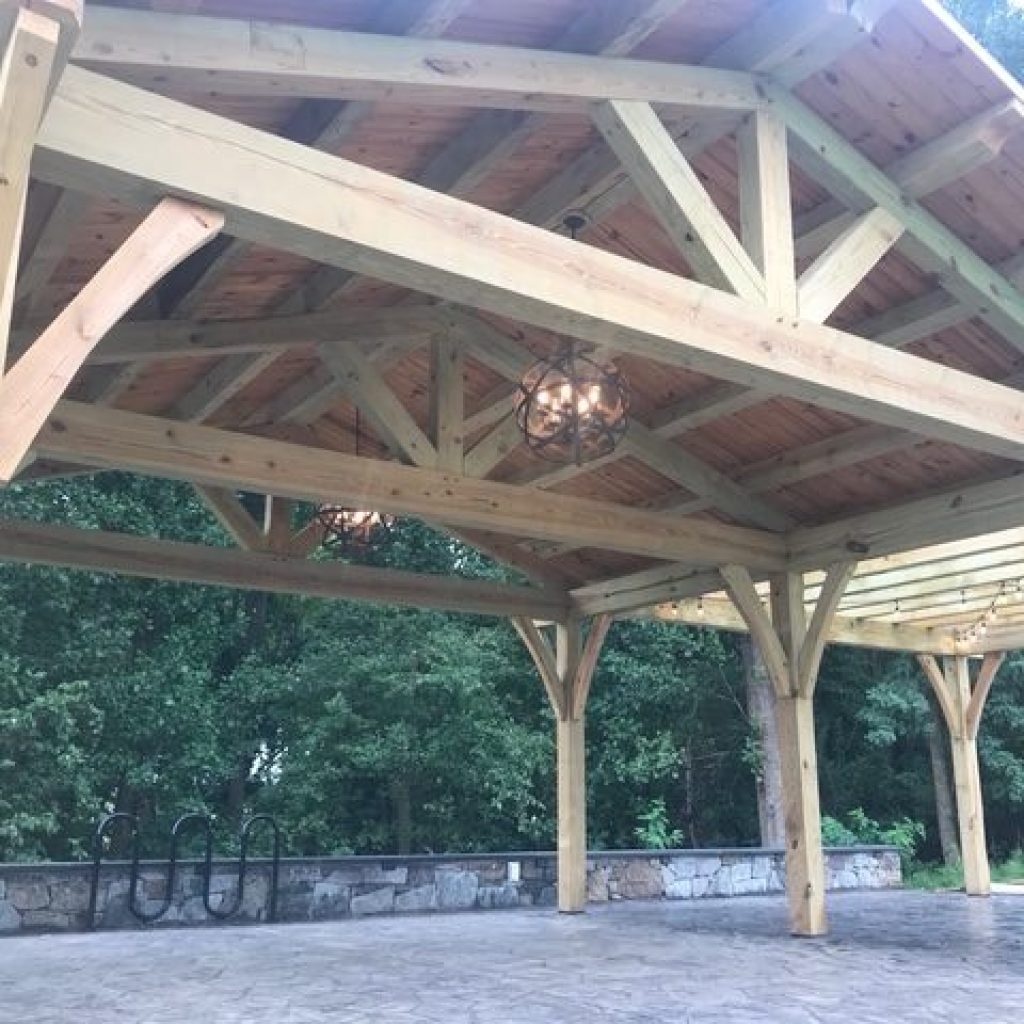 Exposed timber trusses in a post and beam Waynesville NC pavilion