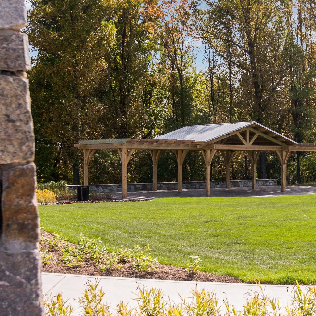 Timber pavilion overlooking a lawn with post and beam Waynesville NC design