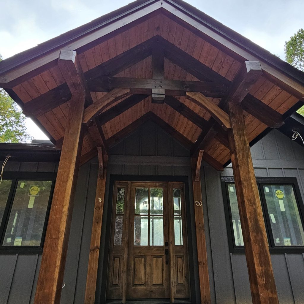 Timber-framed home entrance showcasing post and beam Waynesville NC design